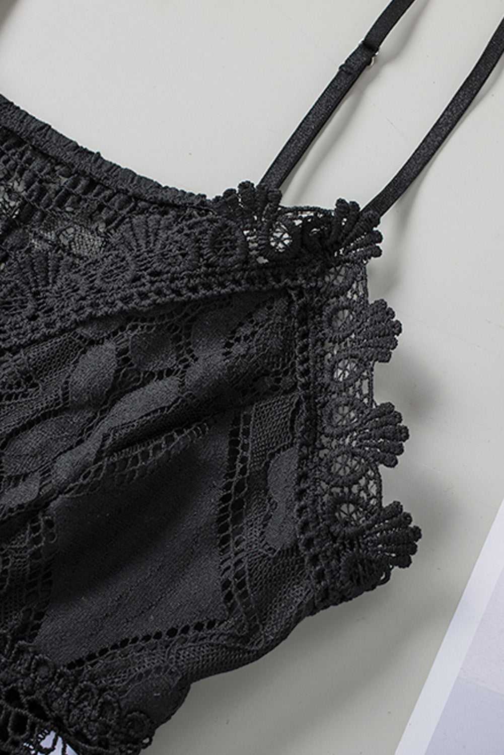 Zoomed-in view of the lace trim and strap on the Black Crochet Lace Bralette Crop Top showcasing its delicate crochet craftsmanship.