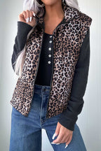 Leopard Print Quilted Puffer Gilet for women styled with black ribbed top and jeans. Sleeveless zip-up jacket ideal for fall layering.