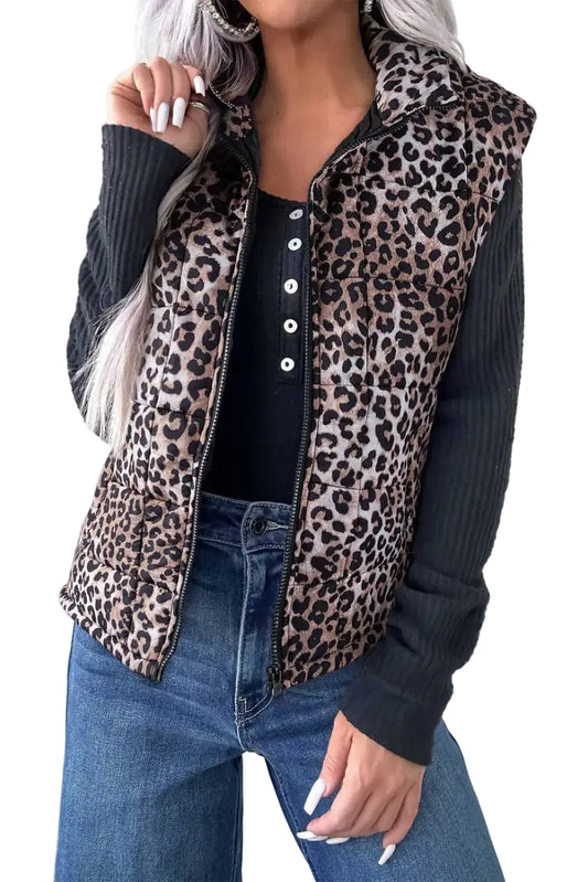 Leopard Print Quilted Puffer Gilet for women styled with black ribbed top and jeans. Sleeveless zip-up jacket ideal for fall layering.