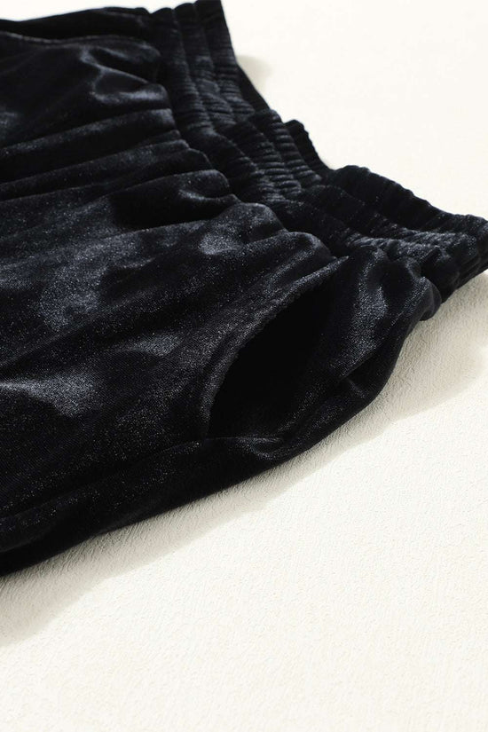 Side pocket and waistband detail of Black Velvet Jogger Trousers, combining functionality with soft-touch velvet for everyday wear.