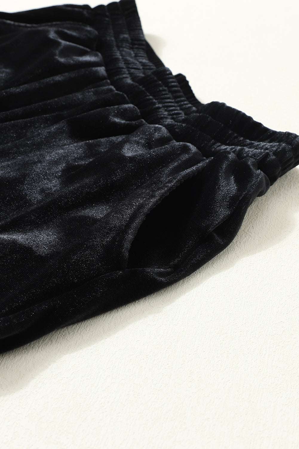 Side pocket and waistband detail of Black Velvet Jogger Trousers, combining functionality with soft-touch velvet for everyday wear.