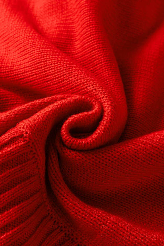 Close-up of soft red acrylic knit fabric, emphasizing the cozy texture of the high neck Christmas sweater.