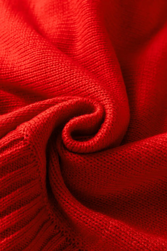 Close-up of soft red acrylic knit fabric, emphasizing the cozy texture of the high neck Christmas sweater.