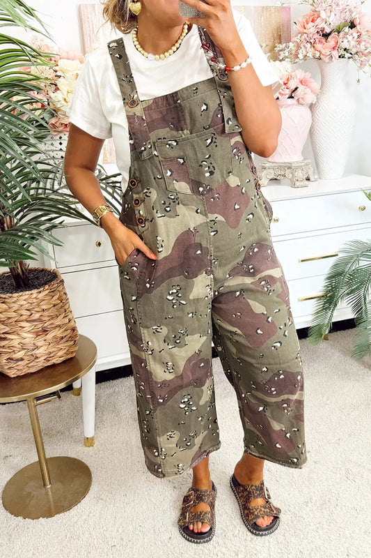 Woman wearing green camouflage and leopard print denim overall cropped jumpsuit with adjustable straps, front view, Fashionfitz UK