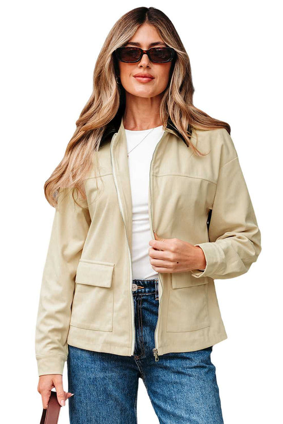 Isolated view of model in Leather Collar Corduroy Jacket, showcasing its beige corduroy fabric and black leather collar.