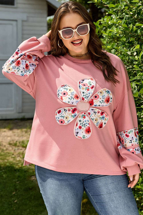 Front view of Curve Blush Peach Floral Appliqué Sweatshirt for Women featuring oversized floral patch and floral sleeve panels, styled for daily wear.