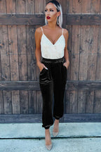 Model wearing Black Velvet Jogger Trousers with a sleeveless top, highlighting chic southern belle style for fall fashion.