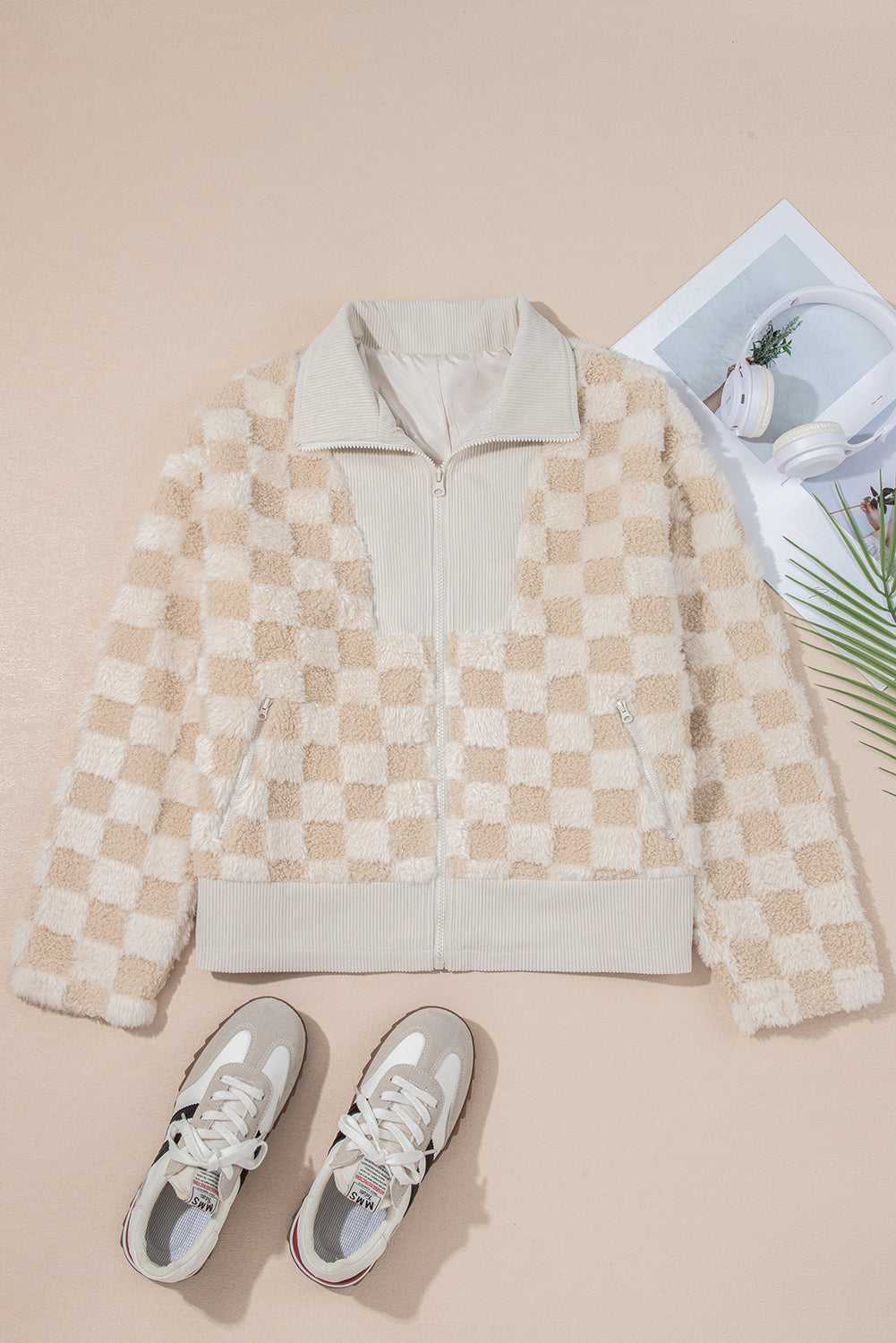 Checkered jacket with sneakers on a beige background