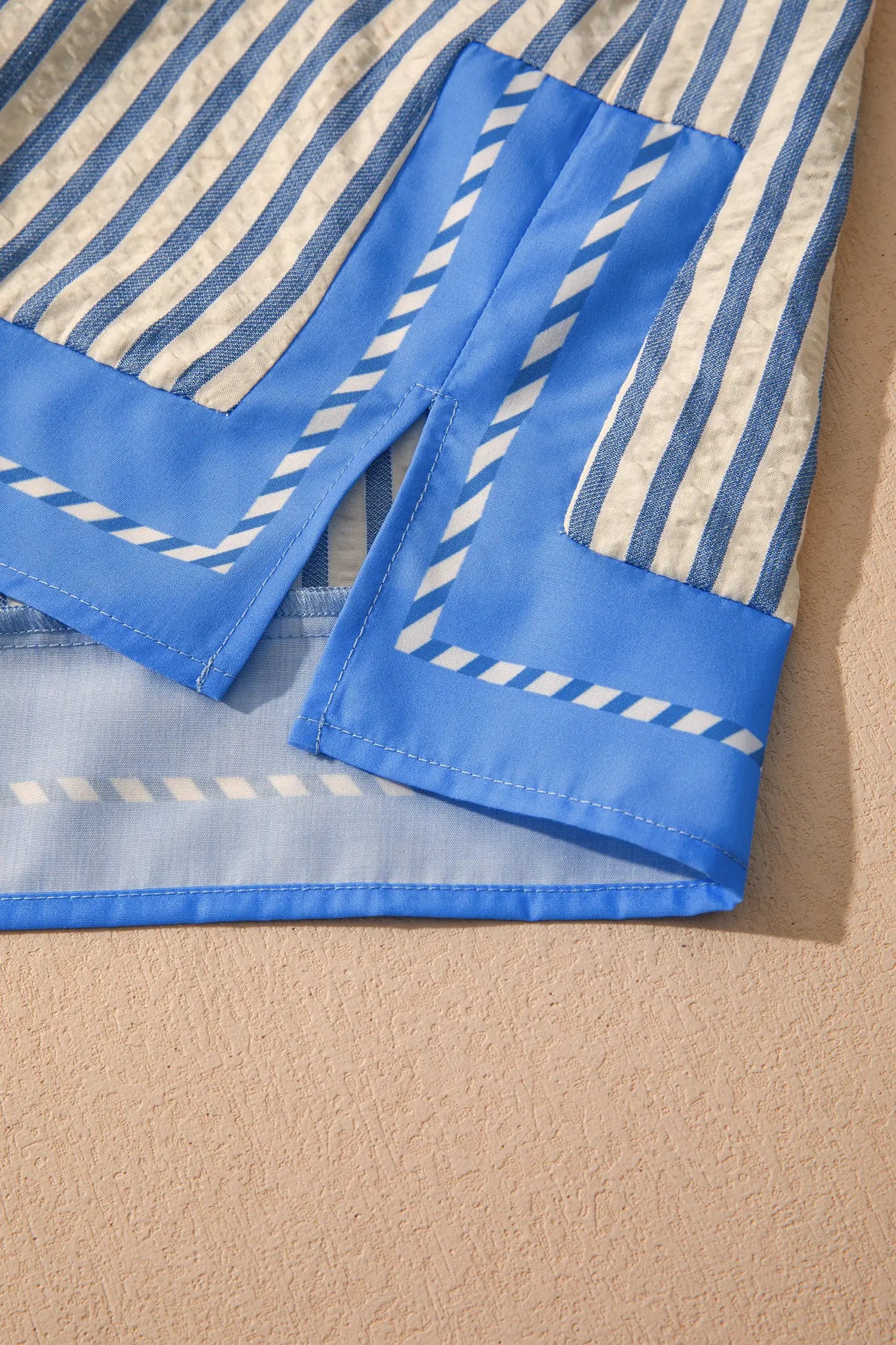 Styled flat lay — sky blue stripe colour block V-neck blouse | Fashionfitz UK