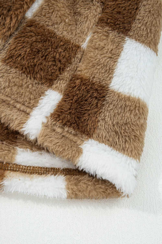Close-up of soft sherpa fleece fabric on Brown Checkered Cardigan, highlighting plush texture and checkered pattern in brown and white.