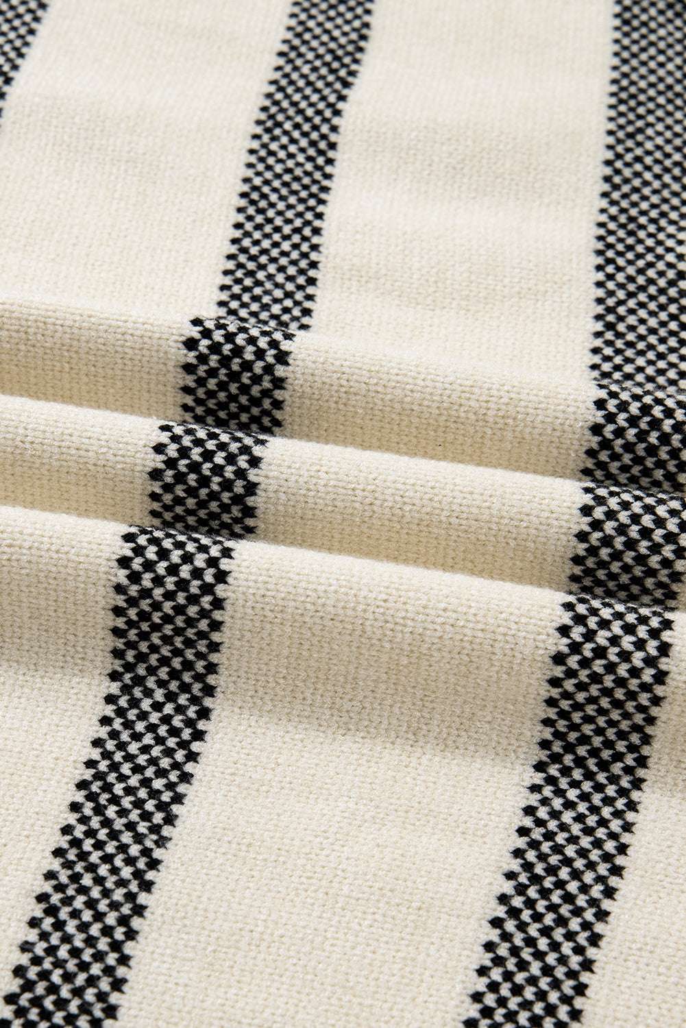 Fabric close-up of Women's Apricot Striped Bell Sleeve Jumper, displaying soft texture and black apricot stripe design. Ideal for fall fashion lovers.