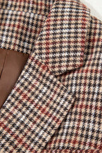 Detailed view of lapel stitching and fabric texture on Ladies Brown Houndstooth Fitted Blazer, emphasizing quality craftsmanship.