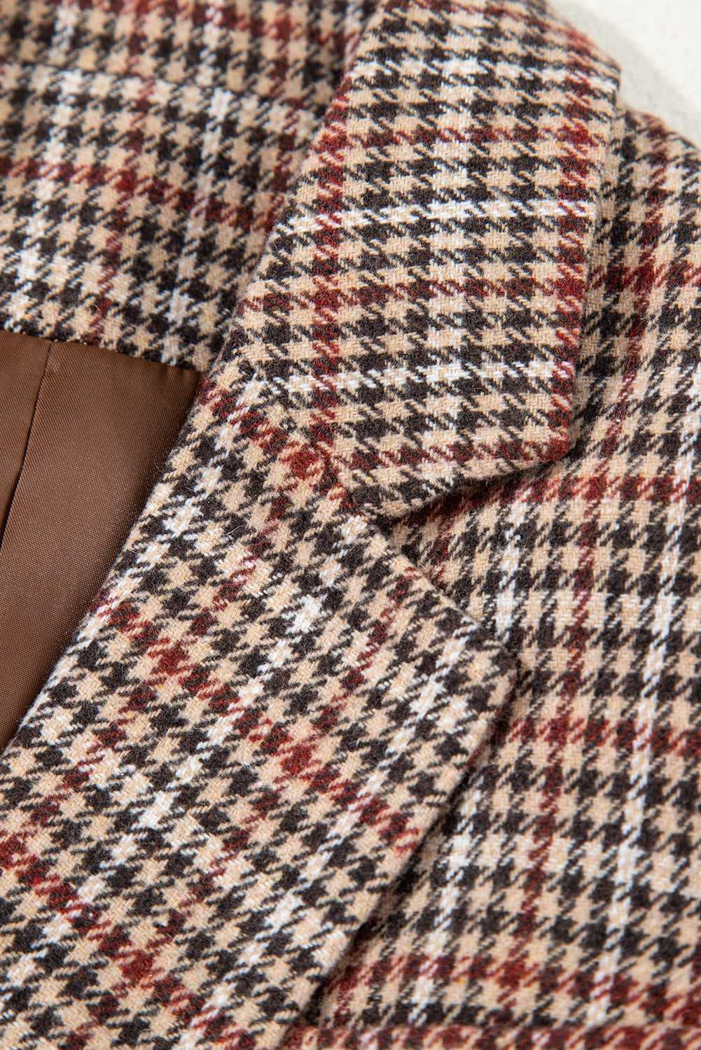 Detailed view of lapel stitching and fabric texture on Ladies Brown Houndstooth Fitted Blazer, emphasizing quality craftsmanship.