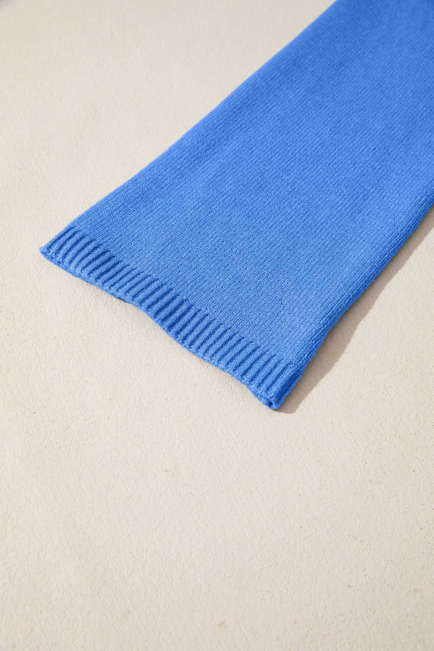 Detail view of blue Bell Sleeve Loose Knit Jumper sleeve with ribbed cuff, highlighting soft knitwear quality.