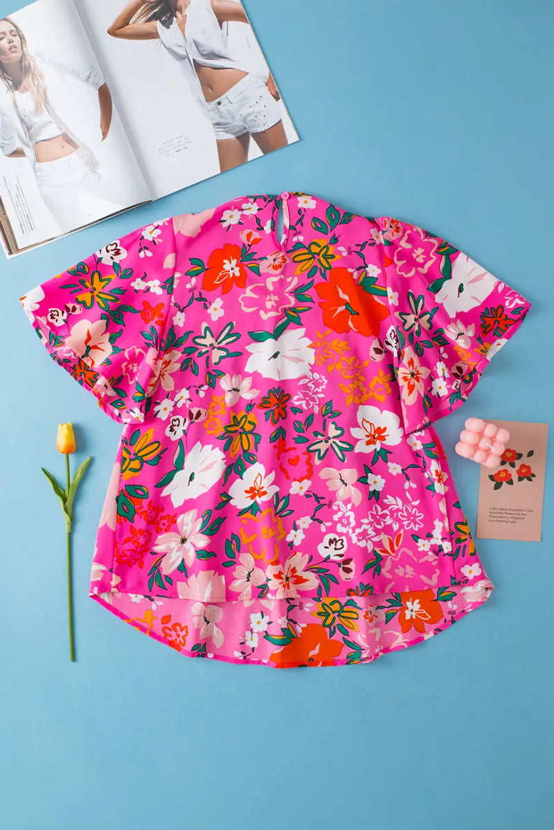Back view of Pink Floral Smocked Blouse showing relaxed silhouette and short sleeve detail — Fashionfitz
