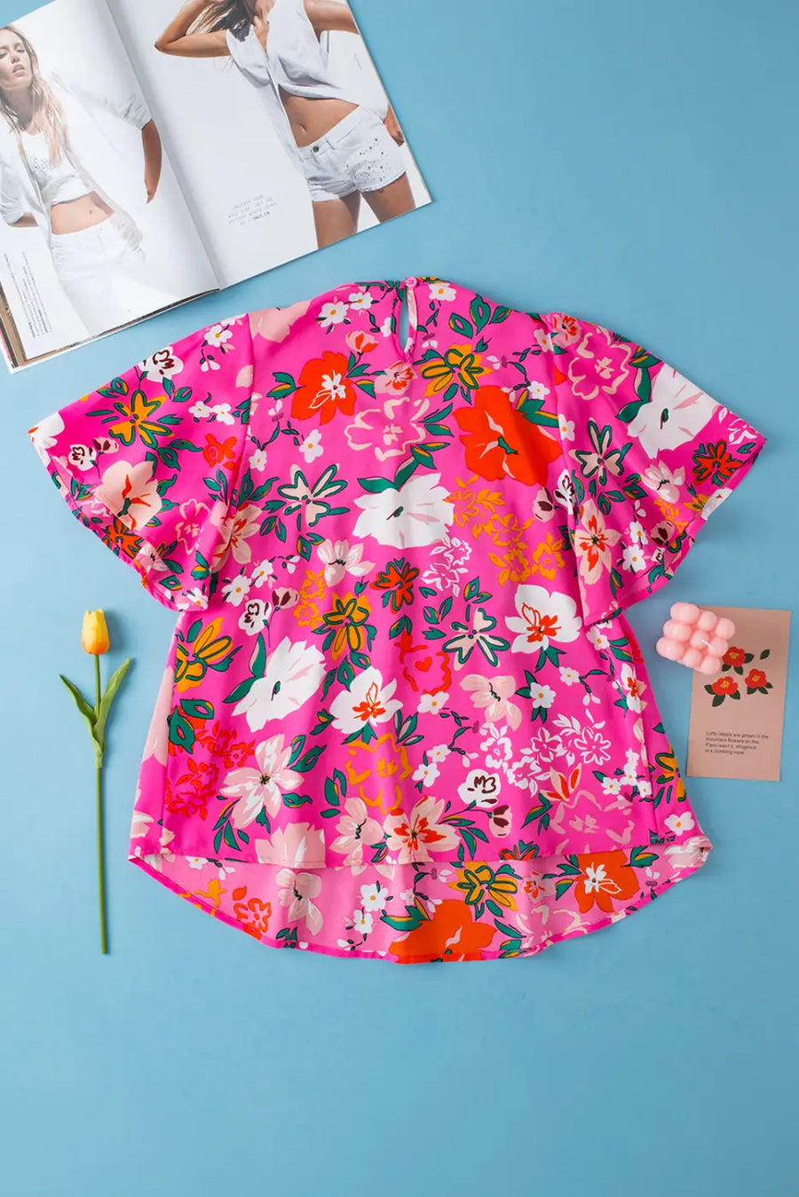 Back view of Pink Floral Smocked Blouse showing relaxed silhouette and short sleeve detail — Fashionfitz