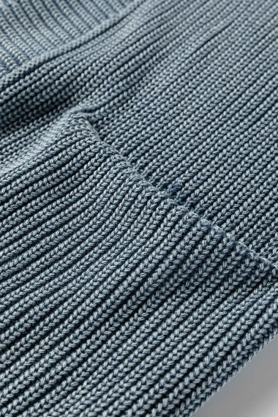 Blue ribbed knit texture and seam detail on Women's Stonewash Patchwork Knit Open Cardigan, showcasing patchwork craftsmanship.