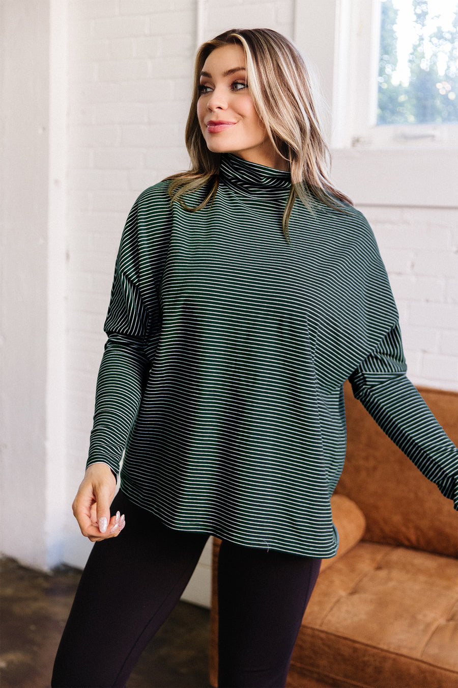 High neck dropped shoulder top styled with straight jeans — Fashionfitz UK