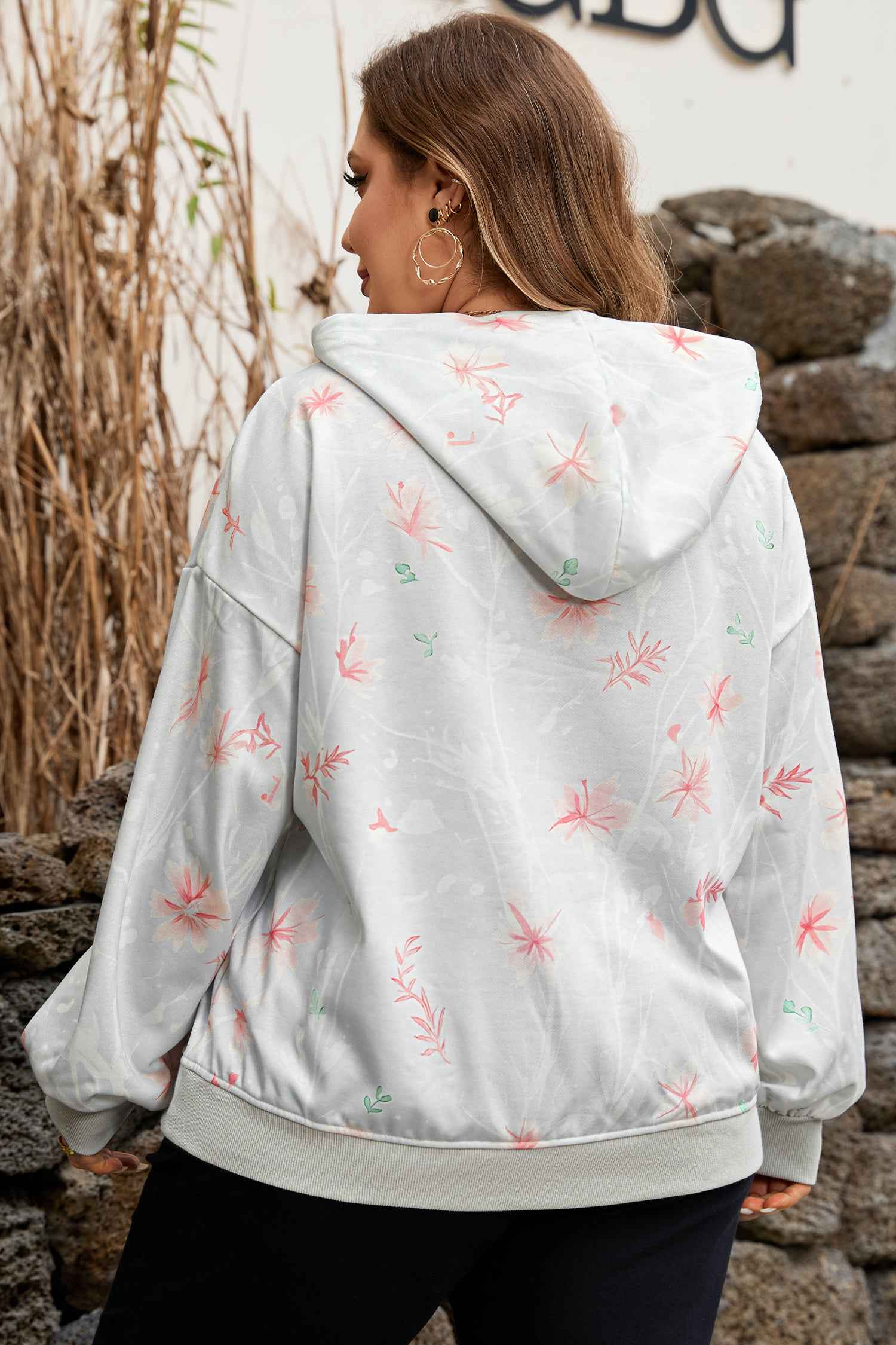 Back view of Curve Floral Print Hoodie showcasing relaxed fit and hood detail, ideal for fall daily wear in plus sizes.