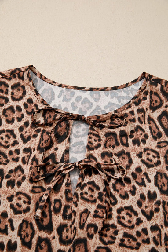 Flat lay of brown leopard puff sleeve bow tie blouse showing full silhouette Fashionfitz UK