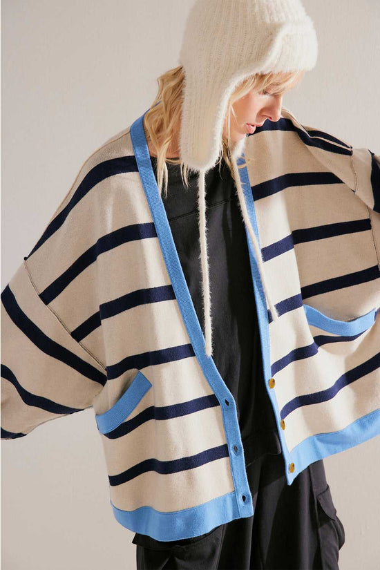 Urban Stripe Loose Cardigan in beige with navy and blue stripe accents, styled open with patch pockets and a relaxed silhouette for daily wear.
