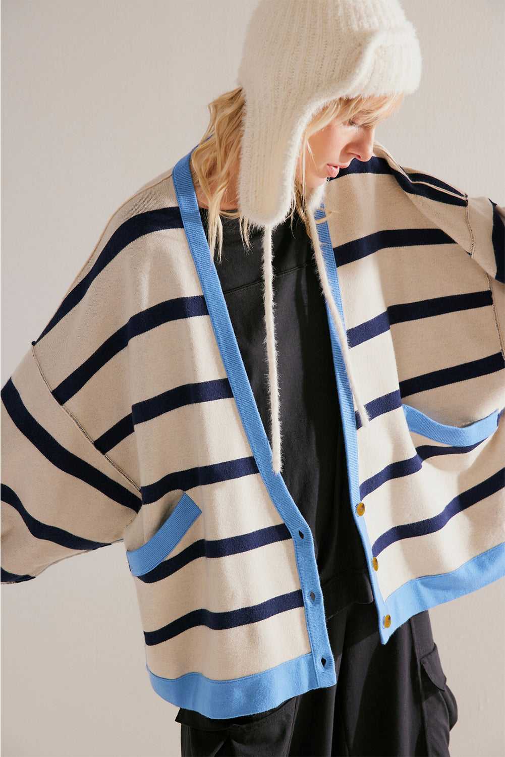 Urban Stripe Loose Cardigan in beige with navy and blue stripe accents, styled open with patch pockets and a relaxed silhouette for daily wear.