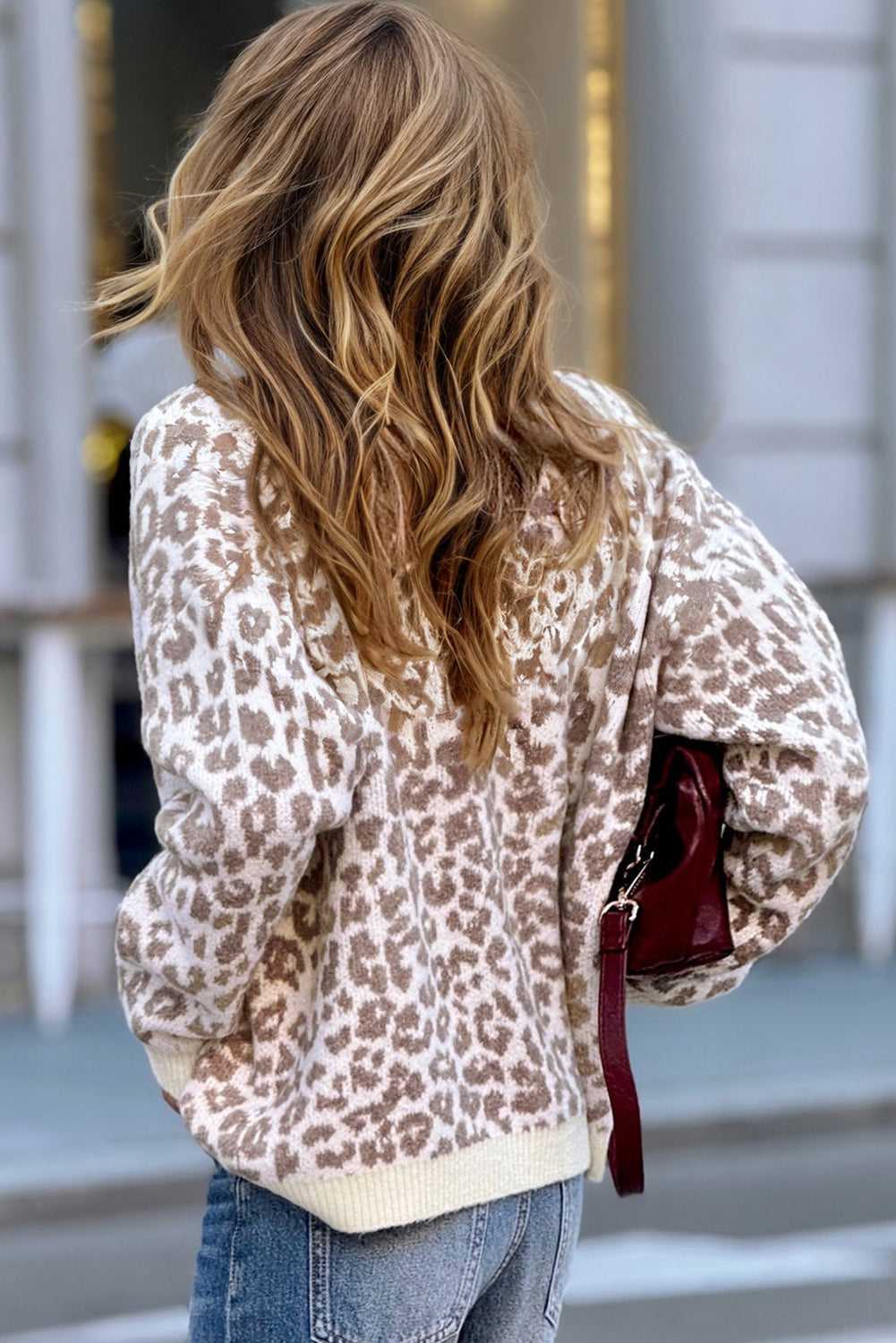 Model wearing khaki animal print cardigan with relaxed silhouette