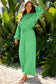Smiling model in green Drop Crop Wide-Leg Pants Set, styled with sandals for a breezy, laid-back fall look.