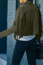Back view of green cropped fringe faux suede jacket showing full fringe detail, paired with black jeans and a casual white tee.