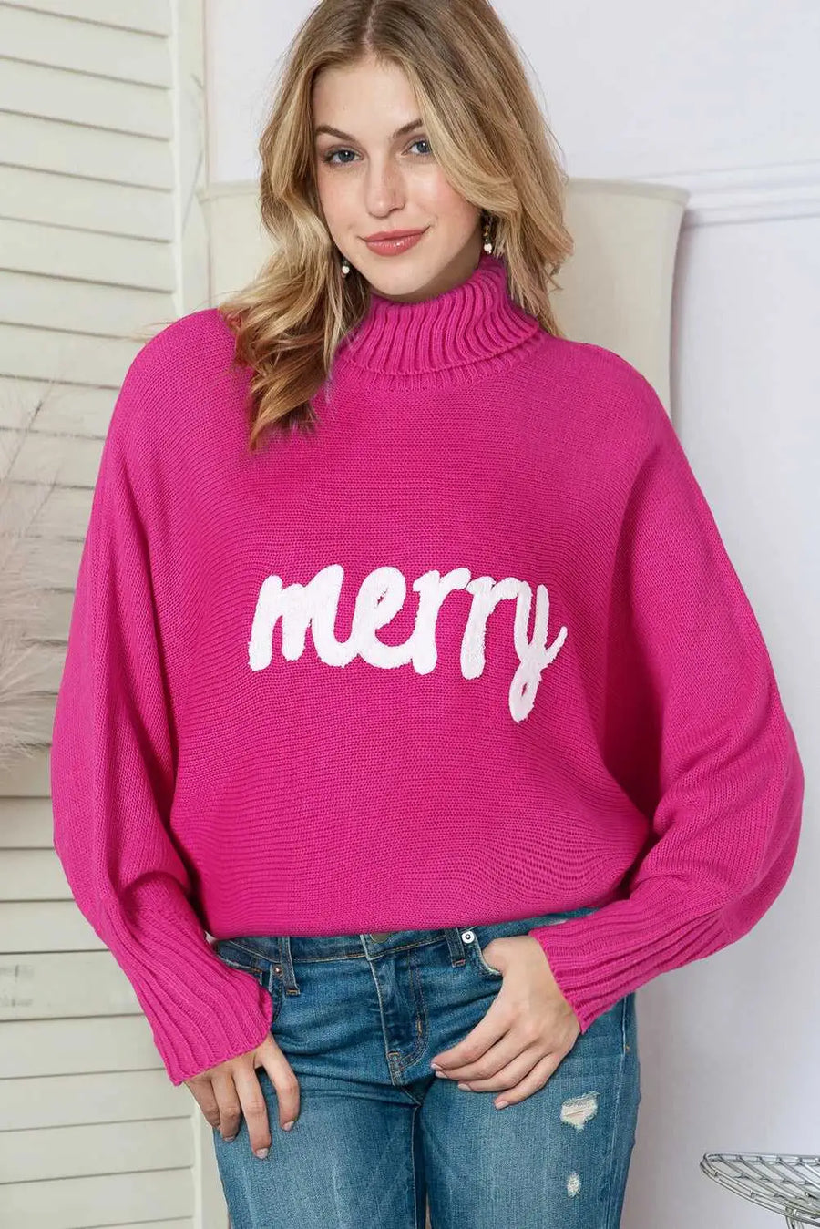 Model wearing the Stylish High Neck Red Sweater - Christmas with 'merry' print, perfect for cozy holiday outfits in winter.