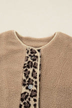 Close-up of neckline and button placket on women’s plush leopard print jacket, featuring sherpa fleece and contrast trim.