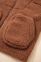 Close-up of front pocket on Women's Zip‑Up Sherpa Hoodie Jacket, showcasing textured sherpa fabric and casual design.