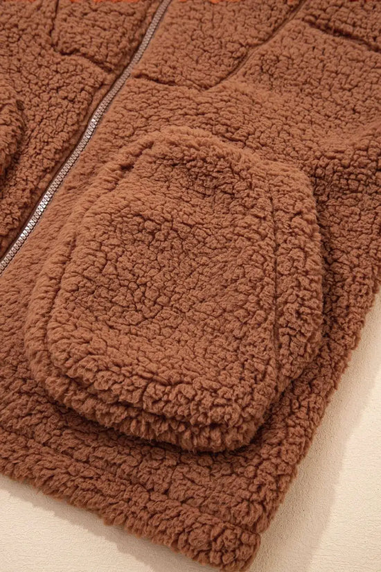 Close-up of front pocket on Women's Zip‑Up Sherpa Hoodie Jacket, showcasing textured sherpa fabric and casual design.