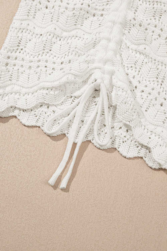 Detailed view of drawstring and scalloped edge on white crochet tank top, showcasing breathable and stylish summer design.