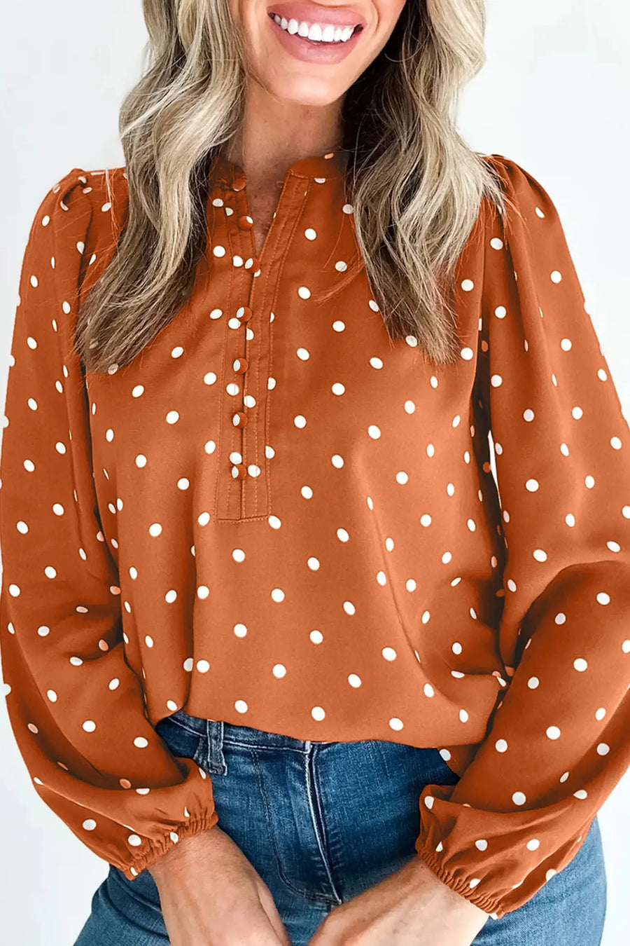 Women's polka dot V-neck blouse UK — fabric and button detail close-up