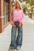 Full body view of model in Pink Floral Lightweight Blouse and wide-leg jeans, styled for a trendy spring look.