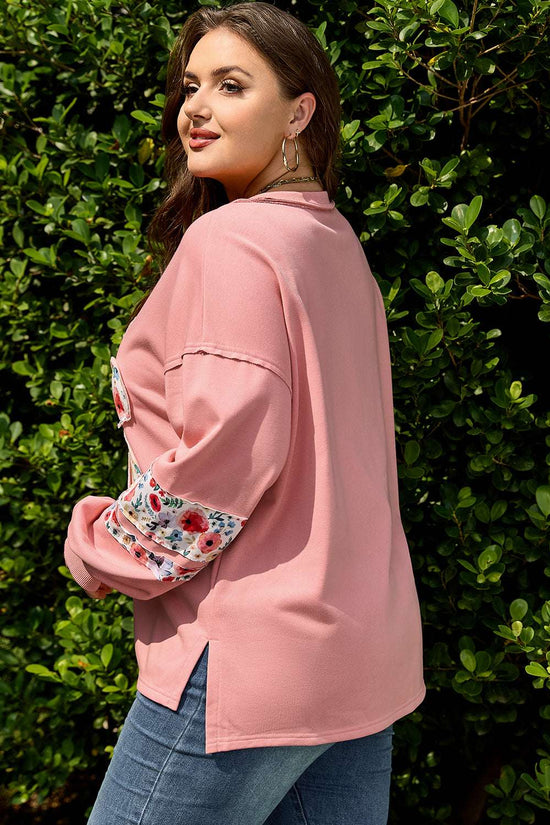 Side angle of Curve Blush Peach Floral Appliqué Sweatshirt for Women highlighting floral sleeve accents and curved hem, perfect for fall layering.