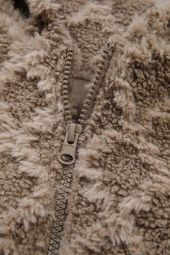 Close-up of zipper detail on Camel Sherpa Fleece Jacket showing durable zip and plush fleece texture, perfect for cold-weather outerwear.