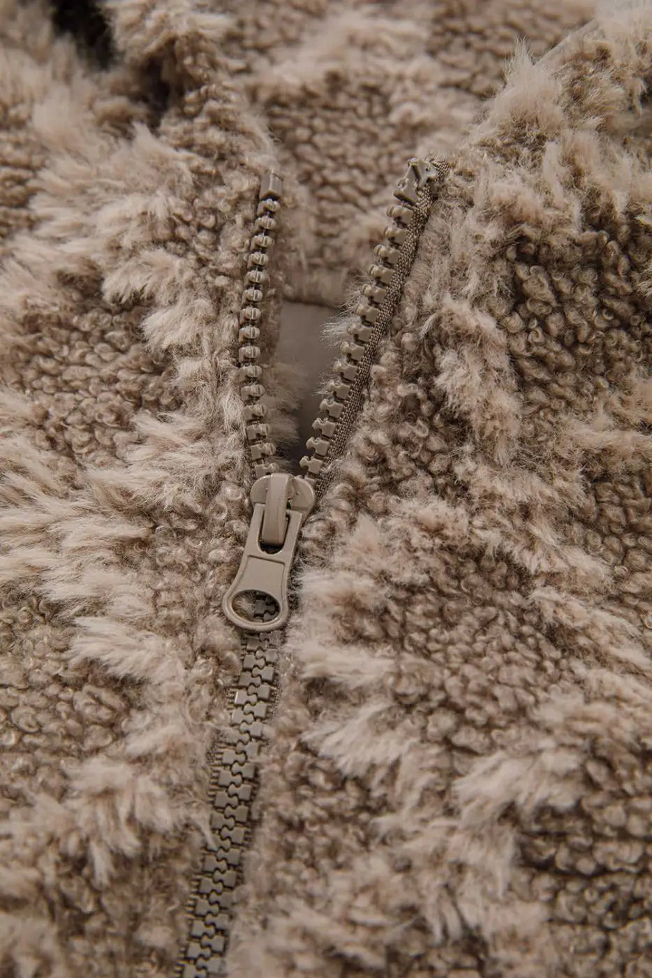 Close-up of zipper detail on Camel Sherpa Fleece Jacket showing durable zip and plush fleece texture, perfect for cold-weather outerwear.