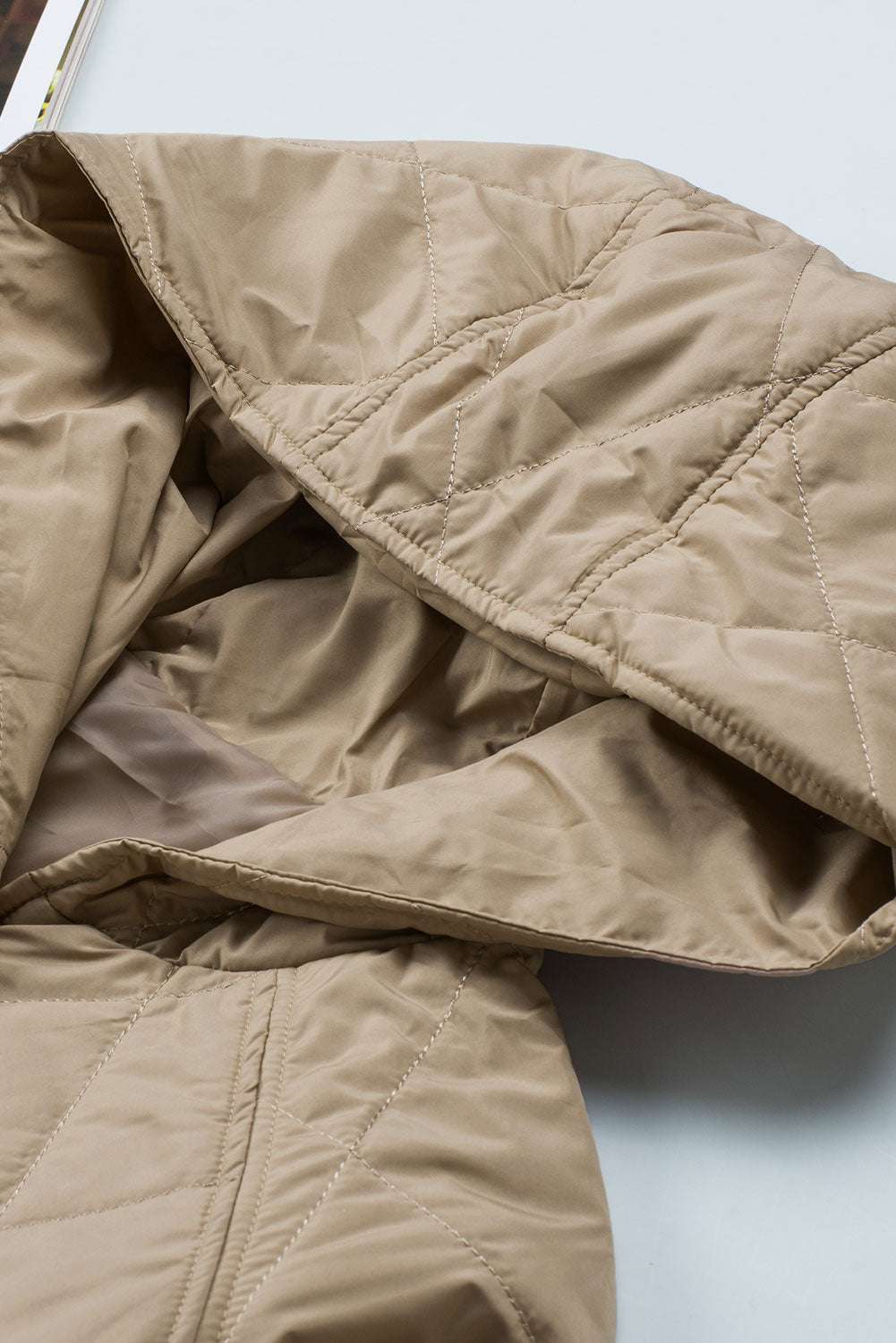 Close-up of hood on Khaki Quilted Puffer Jacket – Hooded Snap Button Coat showing inner lining and stitching for added warmth and comfort.