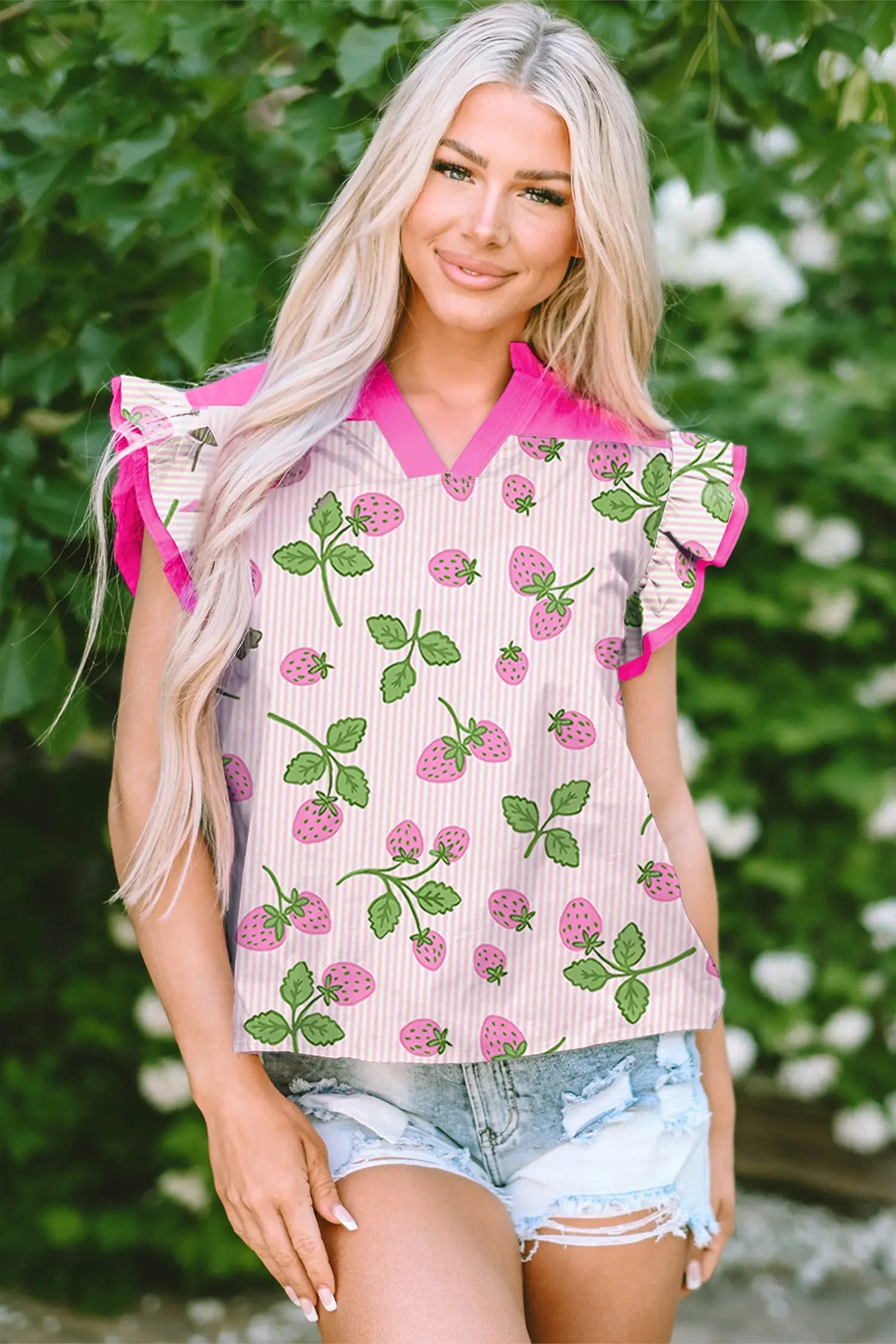 Flat lay of pink strawberry print blouse showing flutter sleeves and patchwork colour block detail Fashionfitz UK