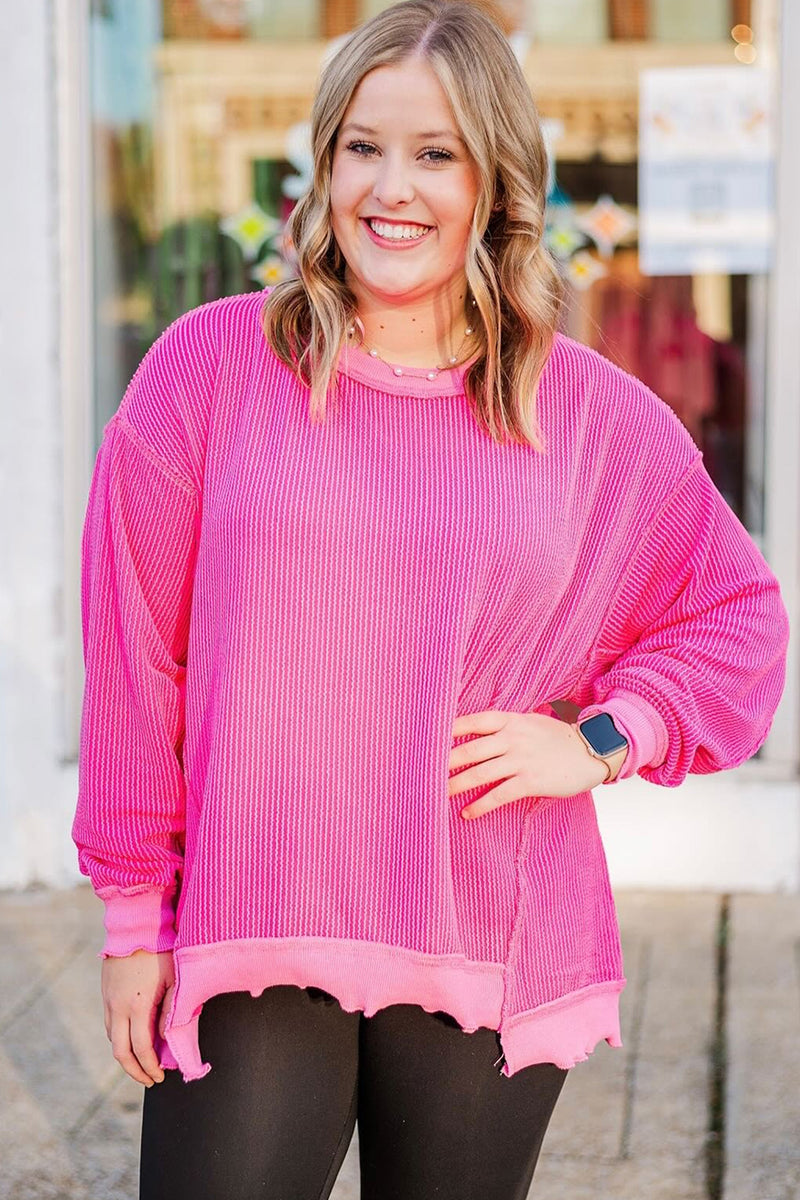 Back view of drop shoulder twisted rib plus size top with uneven hem