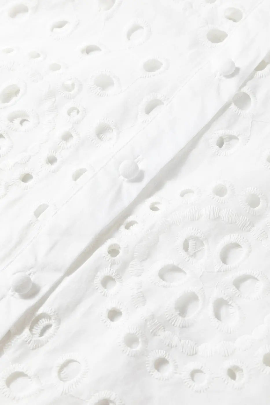 Close-up of front button placket and embroidery on White Cutwork Embroidered Crop Top, emphasizing craftsmanship.