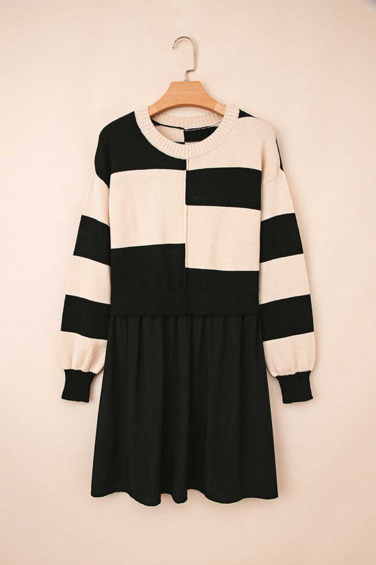 Flat lay of Monochrome Knit Dress - Cozy & Stylish | FashionFitz on hanger, featuring bold horizontal stripes and gathered black skirt.