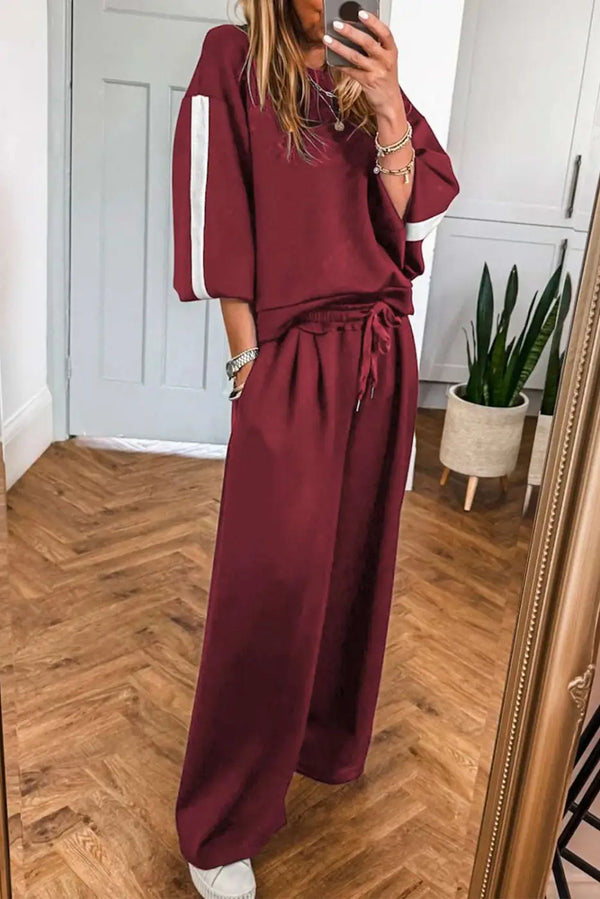 Co-Ord Knitted Wide Leg Jogger with Varsity Stripes in Burgundy featuring relaxed fit and white sleeve stripes, ideal for casual fall loungewear.