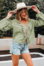 Model wearing Meadow Cotton Blouse - Soft & Lightweight | FashionFitz with wide sleeves and bow cuffs, styled with a hat and denim shorts.