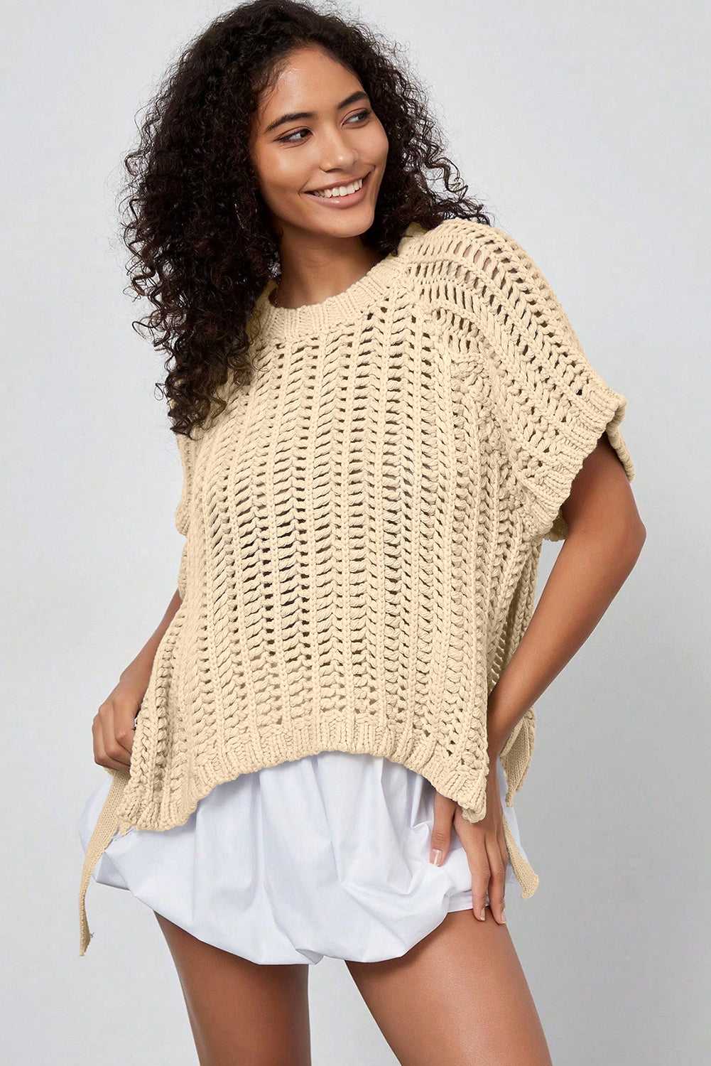 Angled front view of beige Plus Size Bow Tie Open‑Knit Jumper for Women styled casually with lightweight feel.