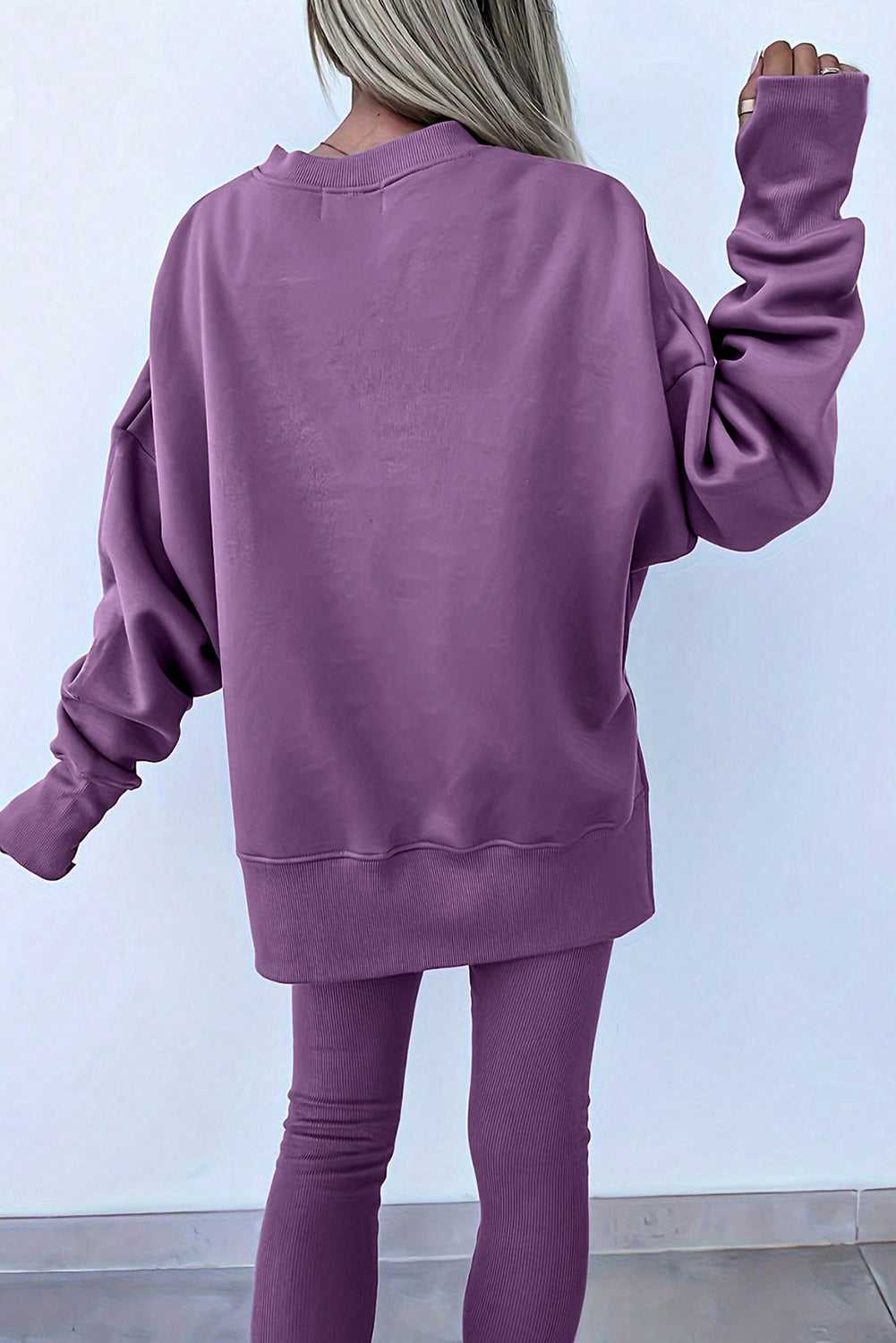 Back view of purple Oversized Sweatshirt and Leggings Matching Set, showcasing the loose fit and ribbed texture ideal for cozy daily wear.