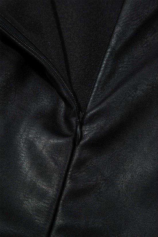 Zipper close-up on Black Vegan Leather Sleeveless Mini Dress, showcasing durable hardware and sleek finish for daily wear.
