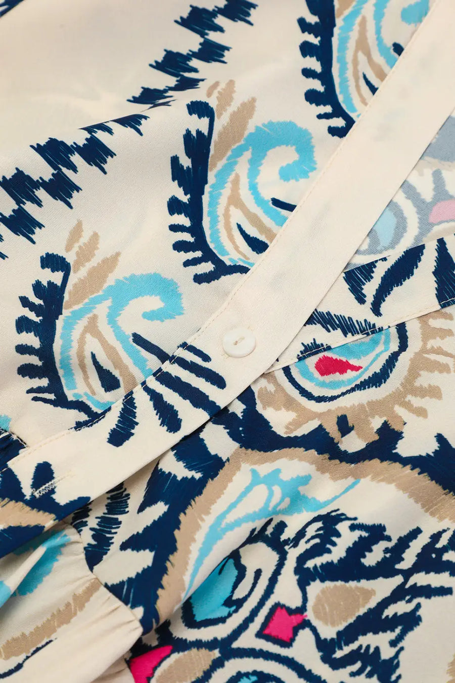 Button detail on the Tribal Mini Dress with bracelet sleeves, emphasizing the quality and design of the bohemian shift dress.